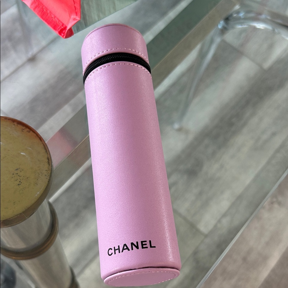 Chanel Pink Travel Case with makeup brushes.